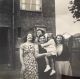 Photo of 4 Women & A Child Outside Of A House Photo of 4 Women & A Child Outside Of A House